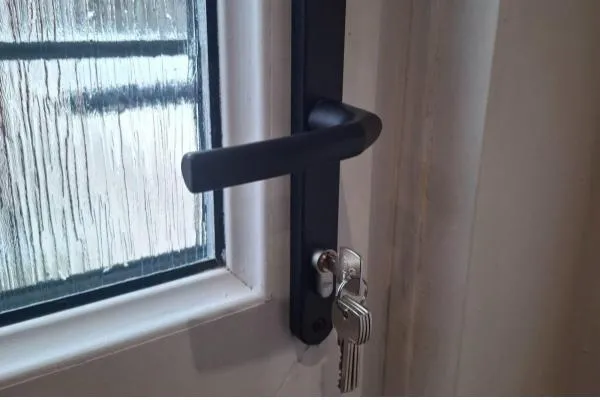 Bozeat Locksmiths replacing the handle and cylinder on a white composite door