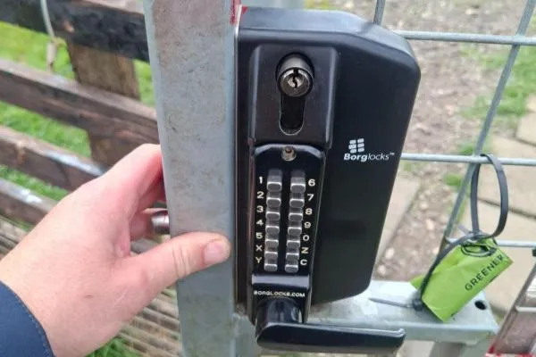 Mechanical keypad lock fitted to a commercial gate in Higham Ferrers.