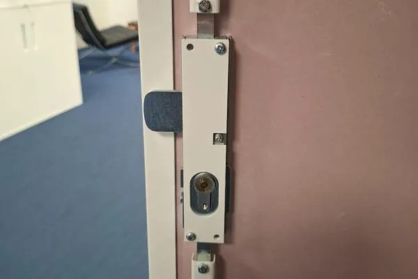 Commercial door locking mechanism repaired by The Parish Locksmith in Rushden.