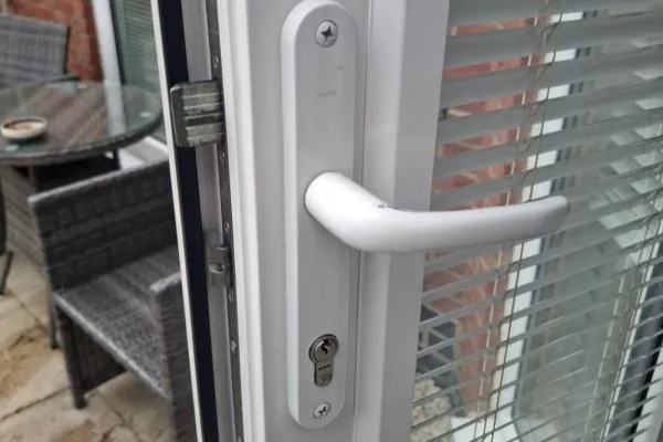 White uPVC patio door with handle, Euro cylinder and multipoint locking mechanism in Raunds