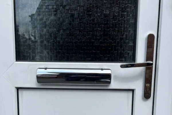 White uPVC front door repaired by The Parish Locksmith in Rushden.