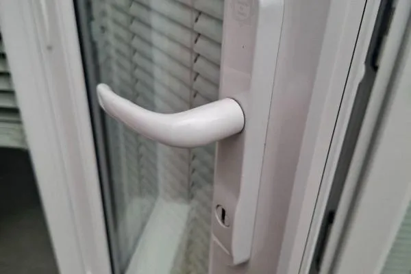 White lever handle and lock on a uPVC door in Wellingborough.