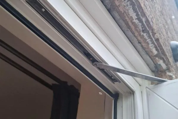Door repair in Wollaston by The Parish Locksmith, adjusting and realigning a French door to restore smooth closing and secure locking.