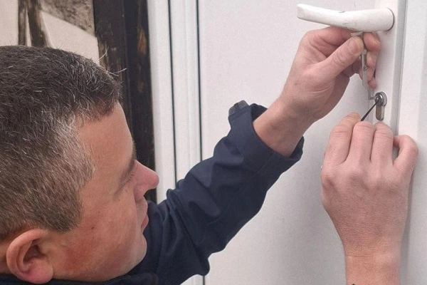 Emergency locksmith carrying out a non-destructive entry for a customer locked out after losing their keys.
