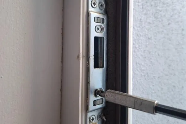 Door lock keep being adjusted to improve latch alignment