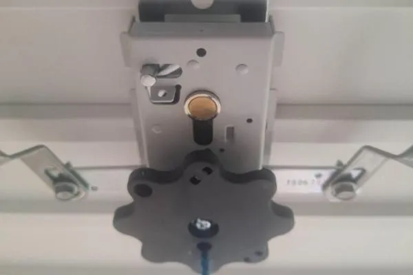 Garage door lock case being repaired during a lock repair in Irchester.