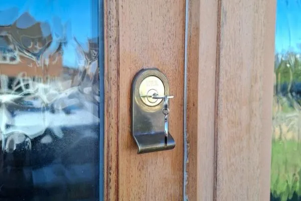 Repaired lock and key fitted to a wooden door in Rushden.
