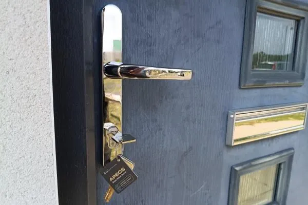 High-security cylinder and new keys fitted to a composite entrance door