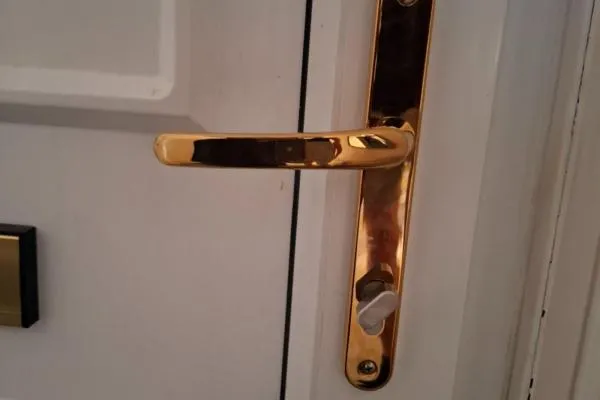 Locksmith services in Earls Barton, involving the fitting of a thumbturn lock on a white composite door