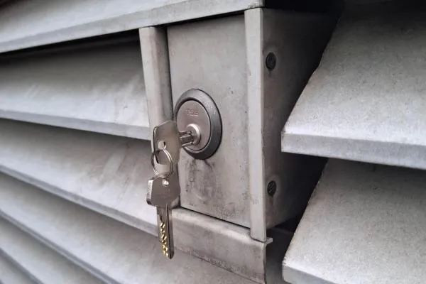 Keys in the lock of a commercial security shutter