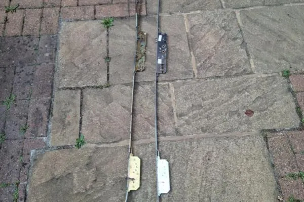 Old and new multipoint locking mechanisms in Earls Barton compared before replacement