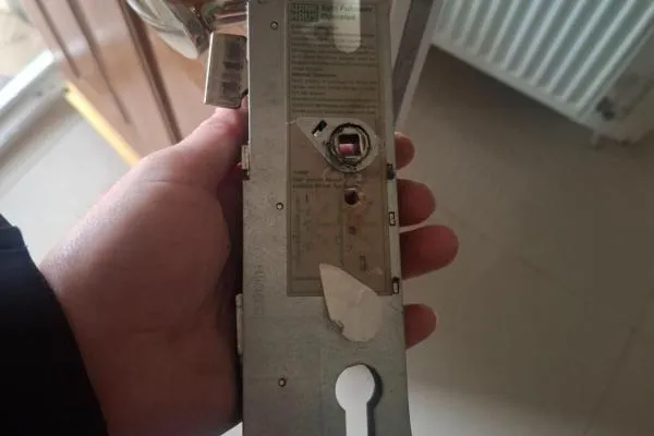 Multipoint locking mechanism in Raunds removed from a composite door for inspection.