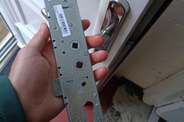Multipoint lock case removed from a uPVC door for replacement in Higham Ferrers.