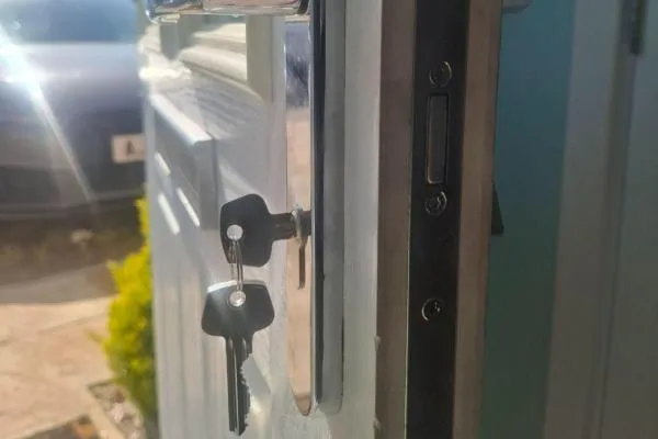 Repaired lock and keys on a residential front door in Rushden.