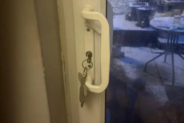 Keyed handle fitted to a glazed sliding patio door