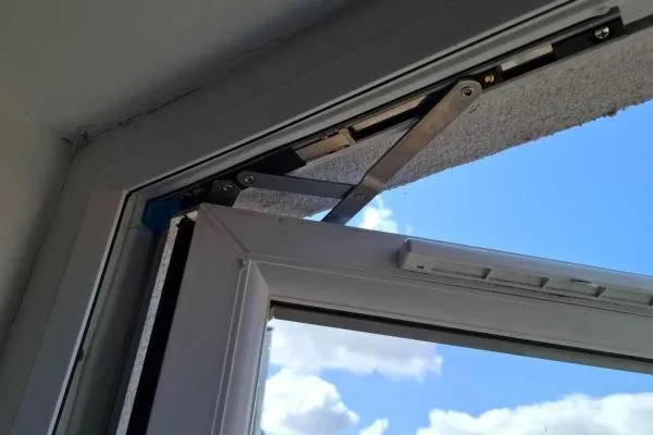 uPVC window friction hinge shown during window repair