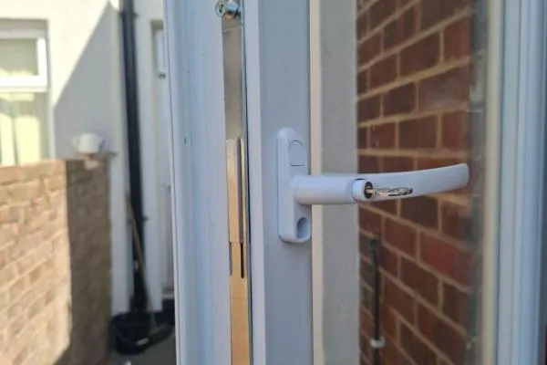 uPVC window lock and handle mechanism shown during repair
