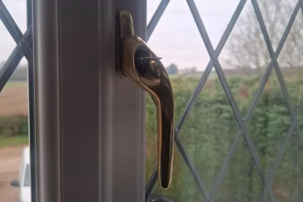 Replacement handle fitted during a uPVC window repair in Irchester.