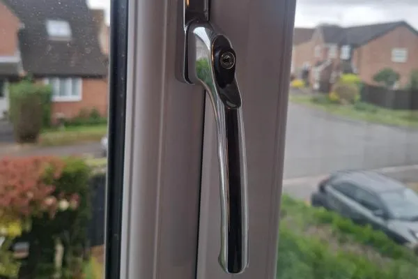 Repaired uPVC window handle with locking key in Rushden.