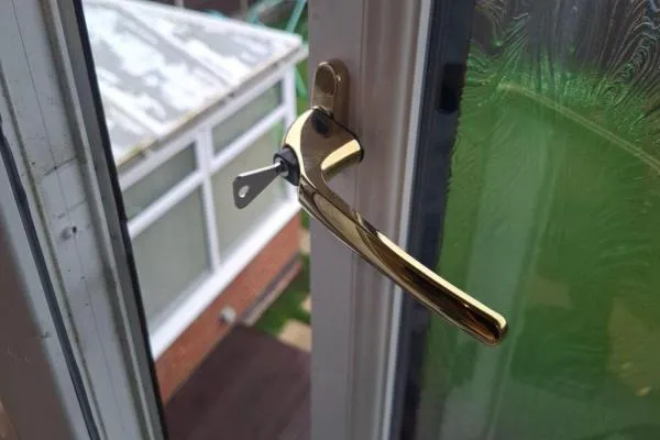 Lockable gold handle fitted to an open uPVC window in Wellingborough.