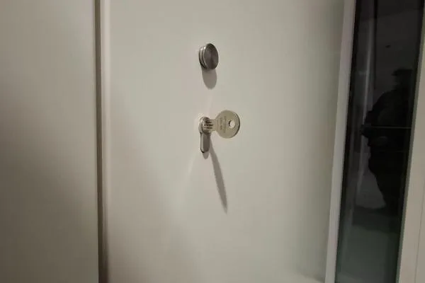Key in a commercial door lock during locksmith work in Finedon