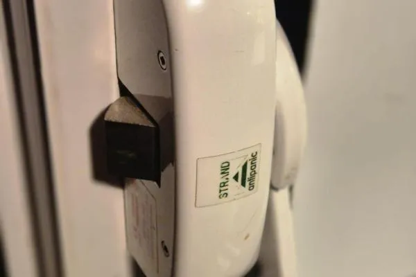 Emergency exit hardware repair on a commercial door