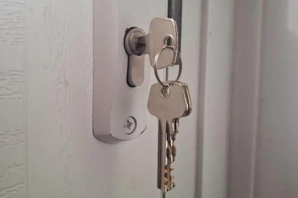 Key in a composite door lock during emergency locksmith work in Finedon