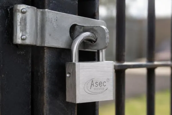 Keyed-alike padlock securing a commercial metal gate