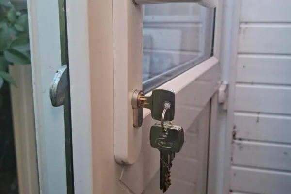 Key in uPVC door lock during locksmith work in Finedon