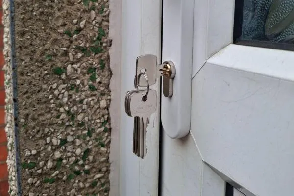 Locksmith in Stanwick fitting a replacement door lock