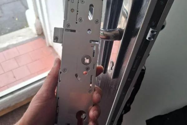 Multipoint locking mechanism removed from a door for repair in Finedon
