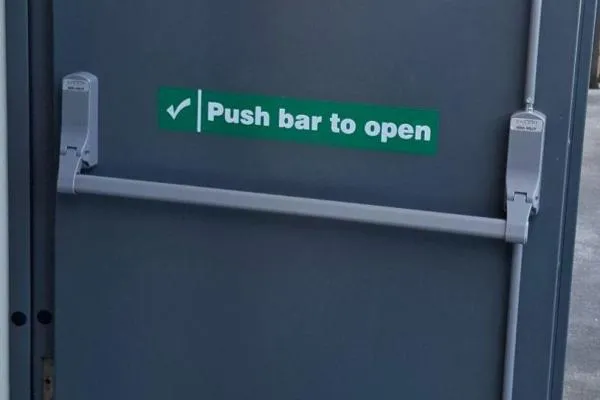 Panic bar replacement fitted to a commercial fire exit door