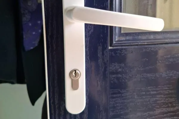 Composite door lock and handle fitted during residential locksmith work in Finedon