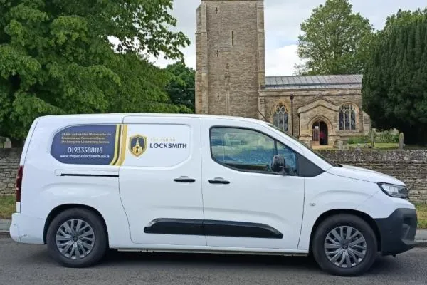 The Parish Locksmith service van parked on a street in Sharnbrook
