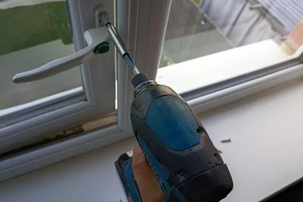 Handle getting reffited on the a uPvc window, after the hinges and lock has been replaced in Bozeat