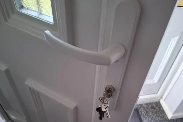 Locksmith in Ringstead replacing a uPVC door lock