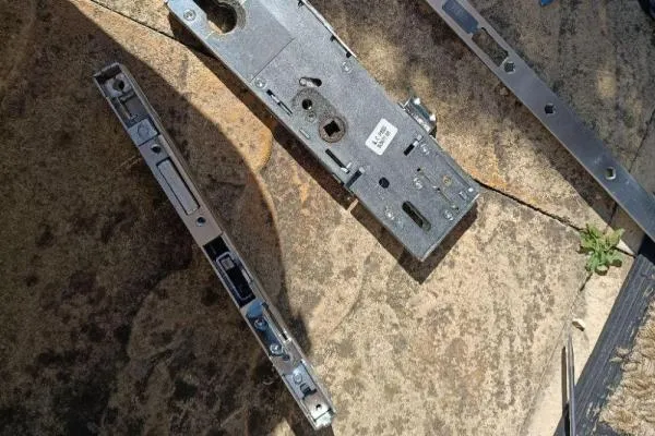 Multipoint door locking mechanism and gearbox components illustrating locksmith repair services in Castle Ashby.