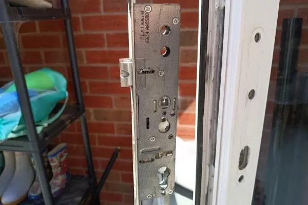 Exposed multipoint locking mechanism on a uPVC door, illustrating lock repair services in Castle Ashby.